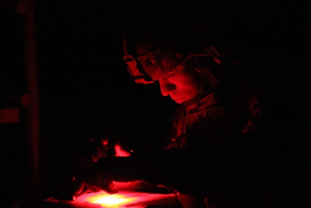 Soldier plots points during land navigation