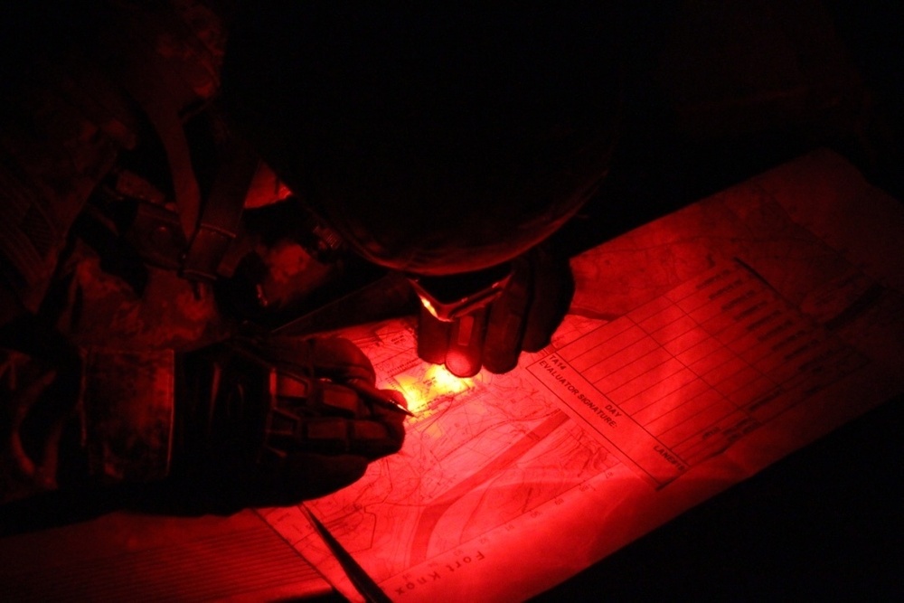 Soldier plots points during land navigation