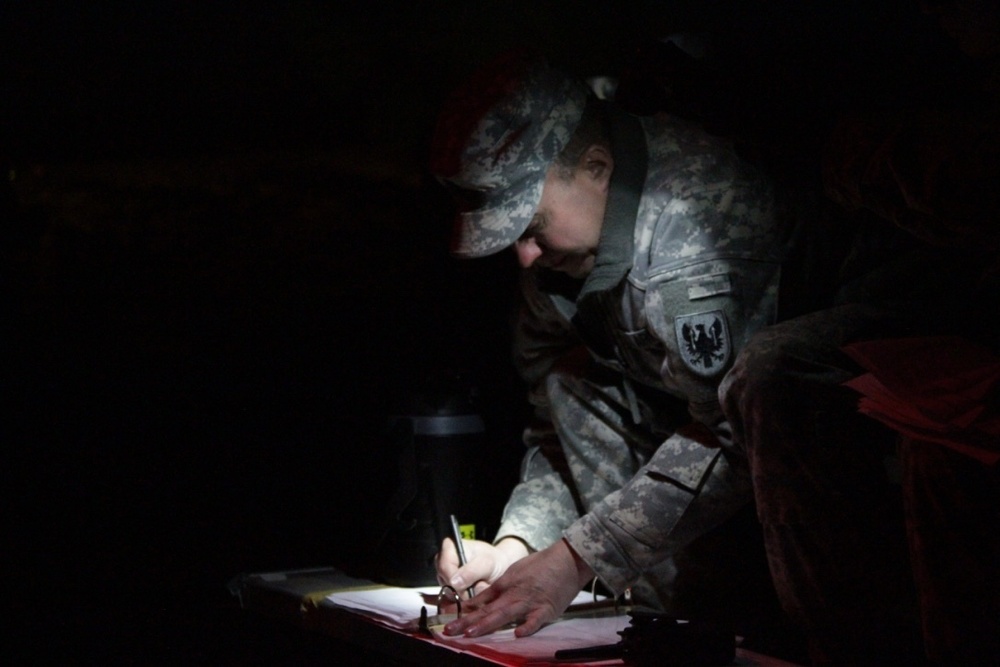 An NCO grades tests prior to land navigation