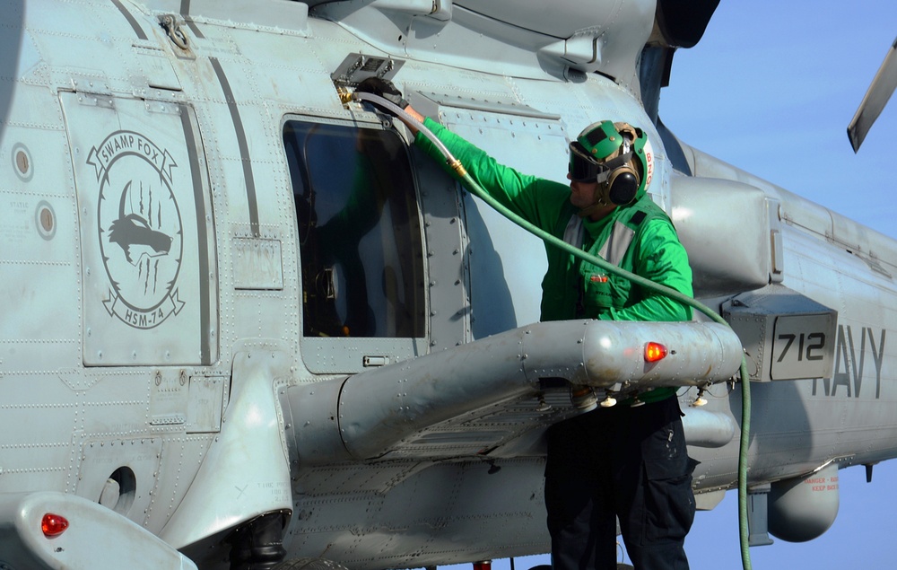 Mason Sailor Performs After-Flight Checks on Helicopter