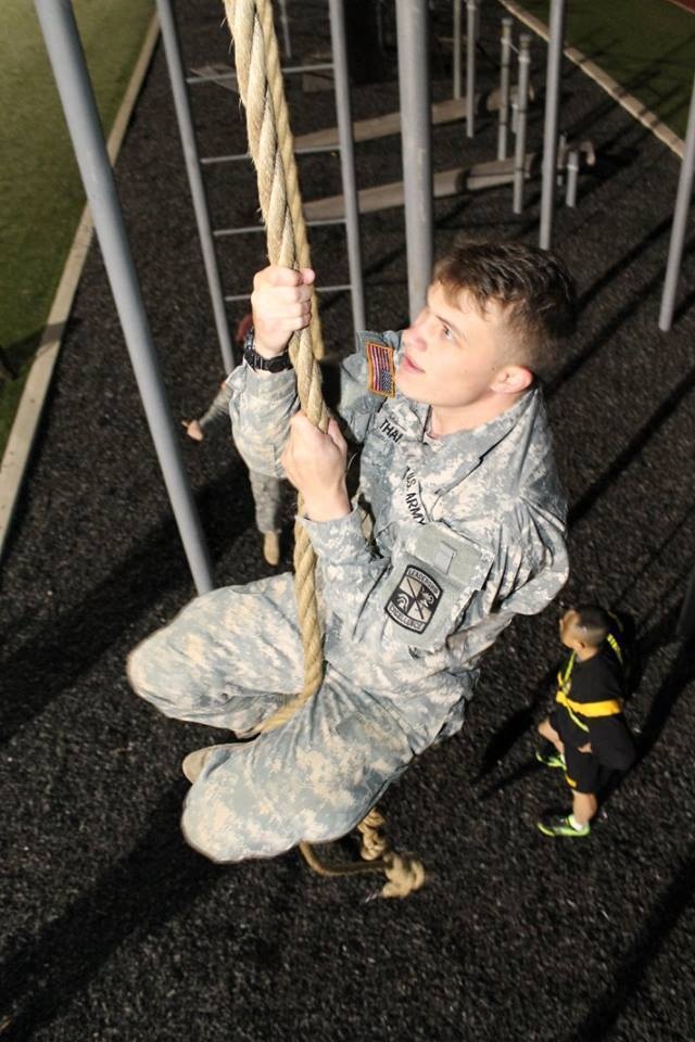 ROTC cadet climing rope