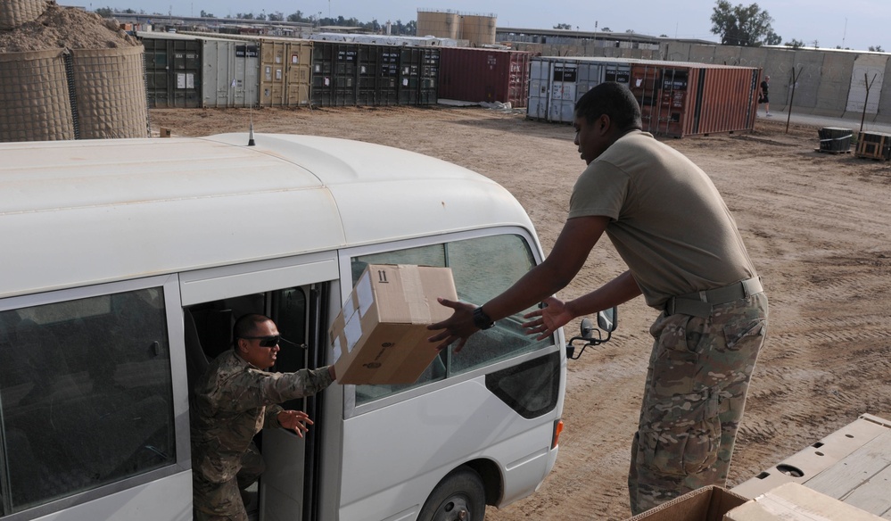 Soldiers in Iraq prepare ITEF supplies for distribution