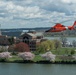 Coast Guard helicopter crew flies above the cherry blossoms