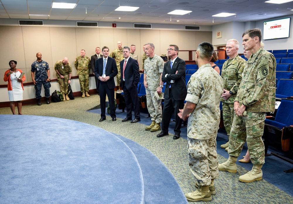 CJCS,SD, SOCOM commander and CENTCOM commander look on during a brief.