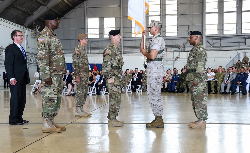 SD and outgoing and incoming CENTCOM commanders stand at attention during the CENTCOM change-of-command ceremony.