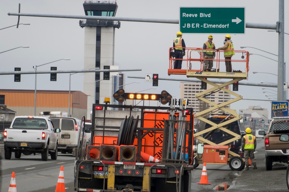 773rd Civil Engineer Squadron Airmen outdated Elmendorf Air Force Base signs with new Joint Base signs in Anchorage