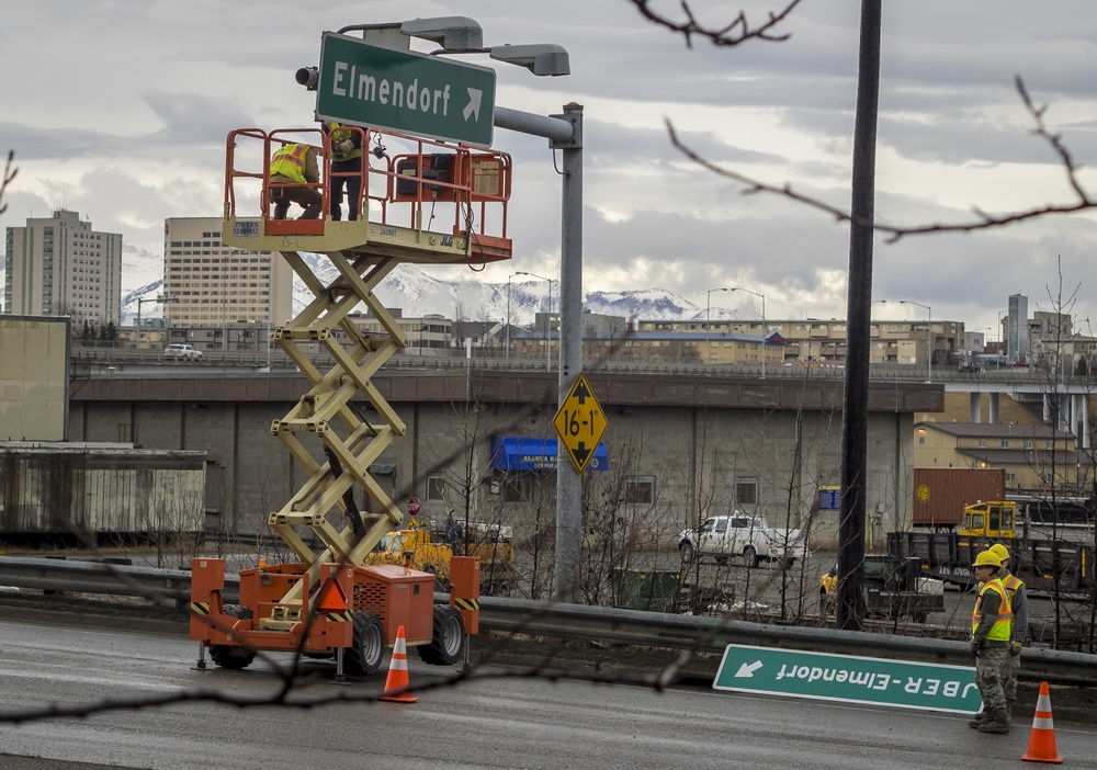 773rd Civil Engineer Squadron Airmen outdated Elmendorf Air Force Base signs with new Joint Base signs in Anchorage