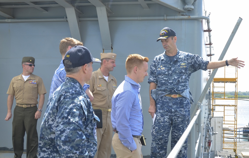 Capt. St. John, CO, USS Frank Cable (AS 40), gives a Congressional delegation tour in Guam