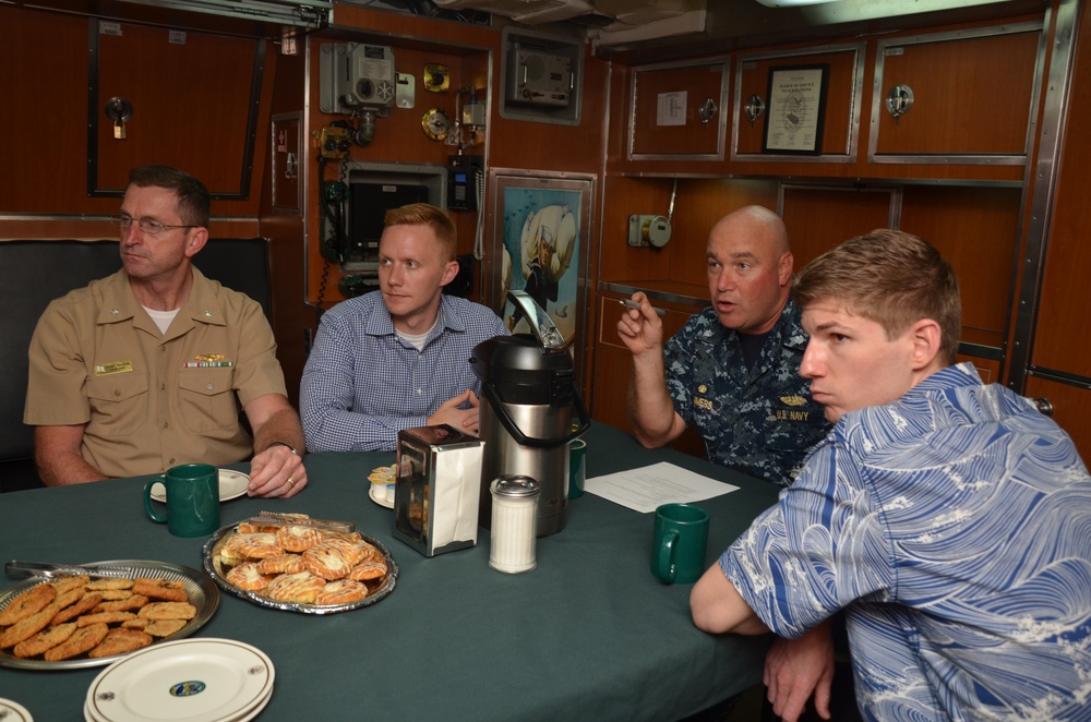 Cmdr. Lammers, commanding officer, USS Topeka (SSN 754), talks to a Congressional delegation during a tour