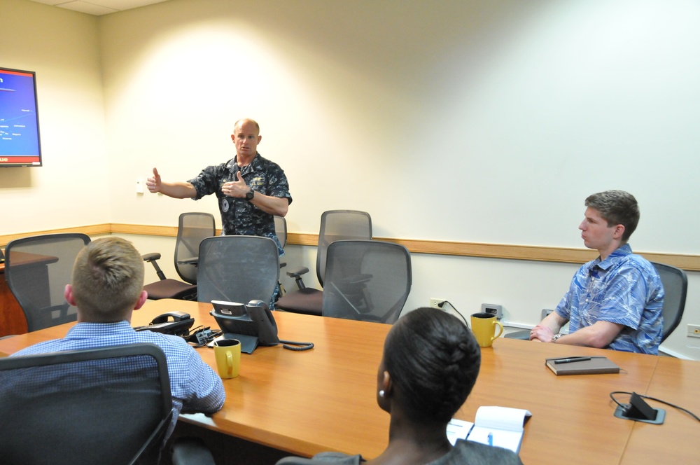 Capt. Grimes, CSS-15, discusses the importance of Guam and the submarine force during a Congressional delegation visit to Guam