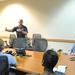 Capt. Grimes, CSS-15, discusses the importance of Guam and the submarine force during a Congressional delegation visit to Guam