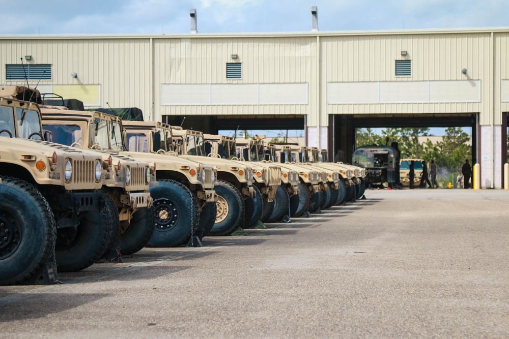HMMWVs parked outside maintenance bay at Ft Bragg, NC