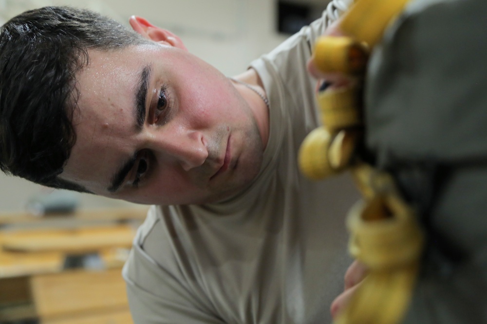 Alaskan paratroopers prepare to jump