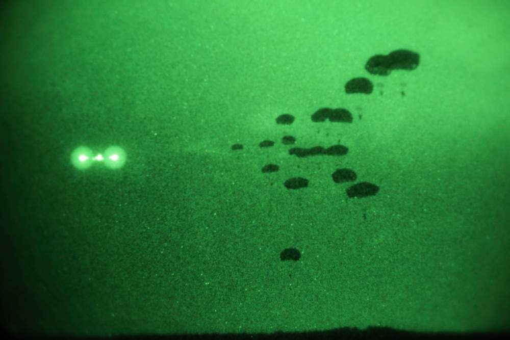 Alaskan paratroopers conduct night jump operations