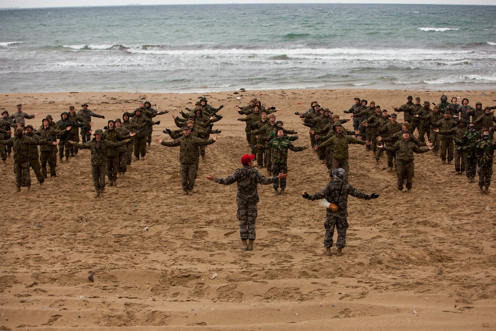 U.S. Marines and R.O.K. Marines conduct warm up exercises