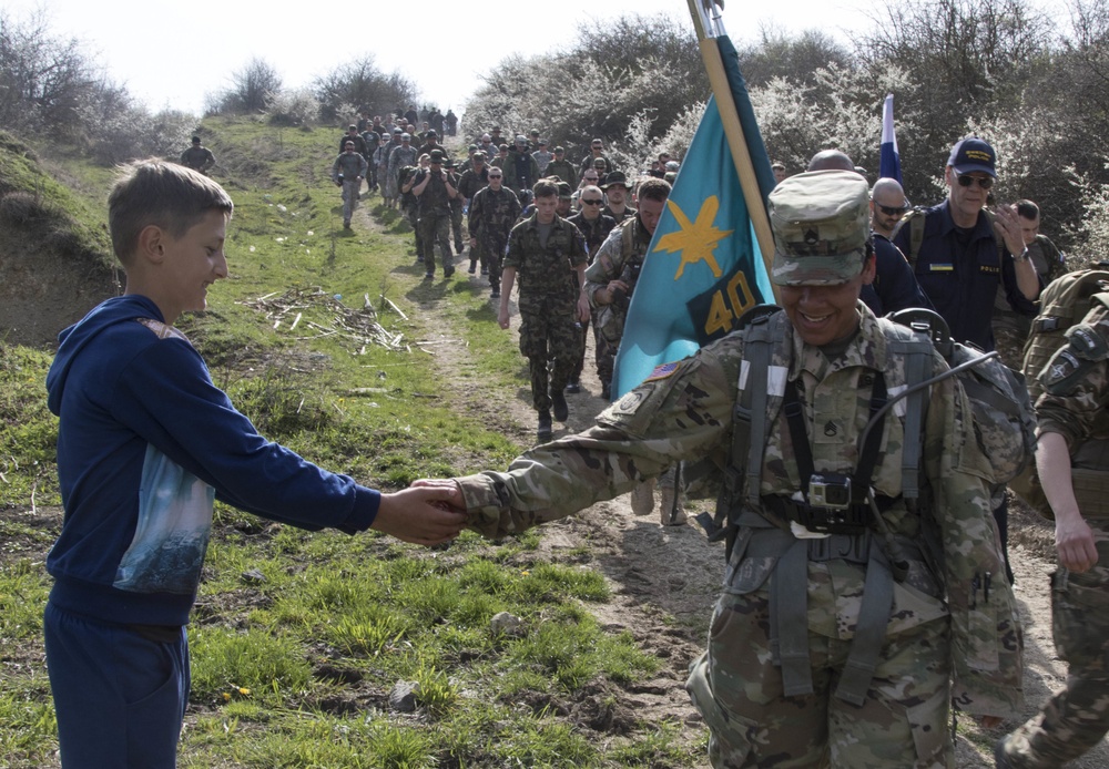 Multinational Soldiers participate in DANCON March in Kosovo