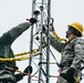 Airmen repair communication towers