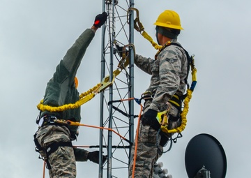 Airmen repair communication towers