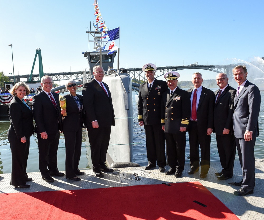 DSD poses for a photo after a DARPA christening ceremony.