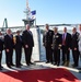 DSD poses for a photo after a DARPA christening ceremony.