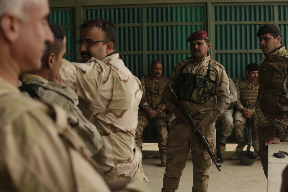 Iraqi soldiers assigned to Taji Military Complex Guarding and Protection Battalion, conduct vehicle search, marksmanship, detainee search training