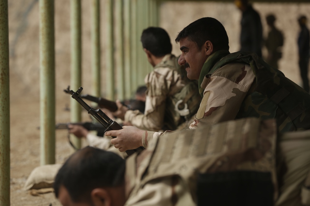 Iraqi soldiers assigned to Taji Military Complex Guarding and Protection Battalion, conduct vehicle search, marksmanship, detainee search training