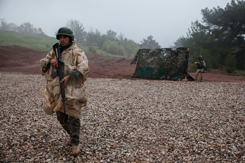 Peshmerga soldiers conduct a live fire exercise under supervision of coalition forces
