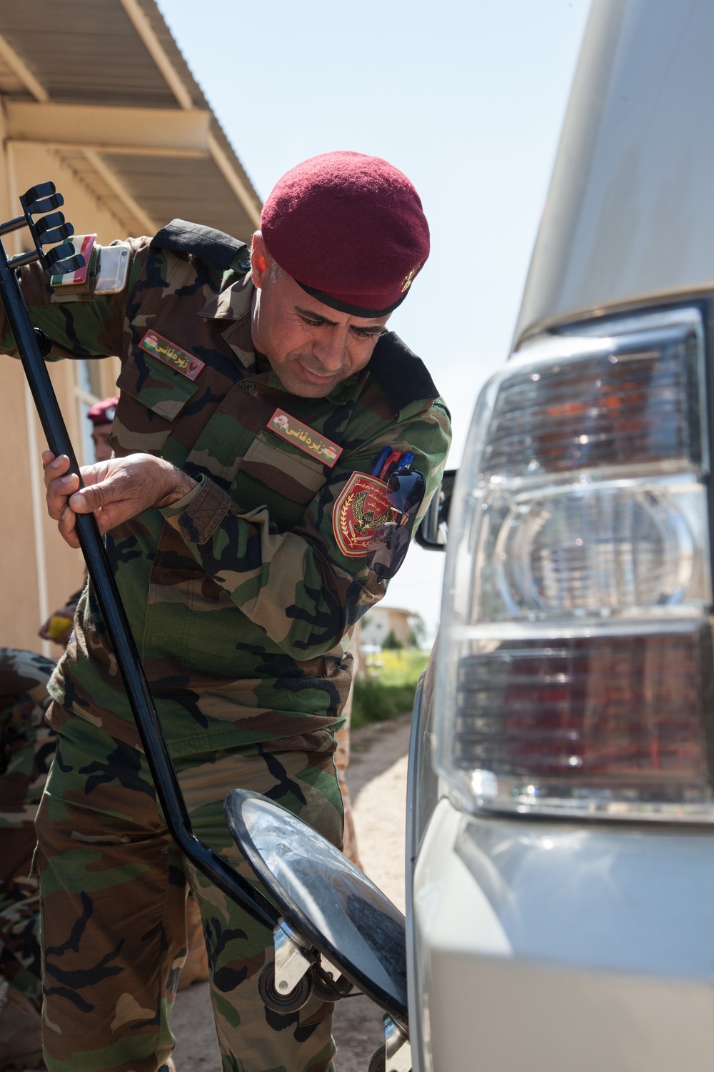 Zeravani officers take class on vehicle inspection at check points