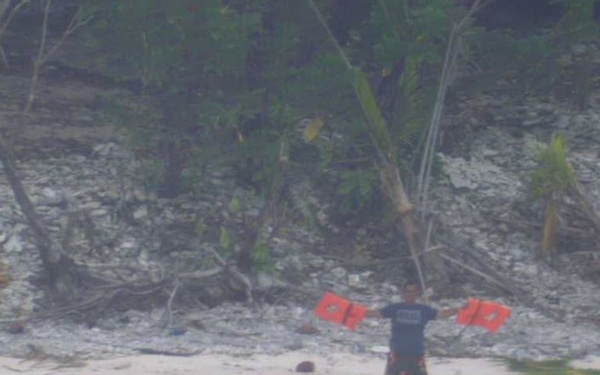 castaways rescued after spelling 'help' with palm leaves on remote island