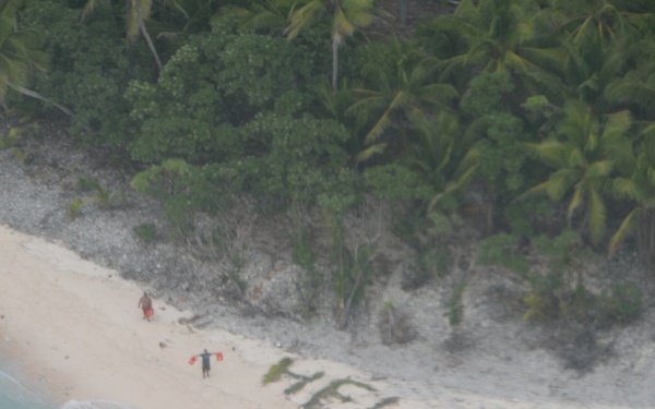 castaways rescued after spelling 'help' with palm leaves on remote island
