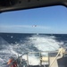 Coast Guard rescues 4 men after boat takes on water