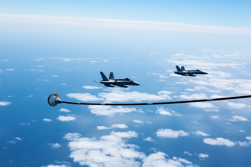 SPMAGTF-CR-AF KC-130J's and Spanish F/A-18's conduct an aerial refuel