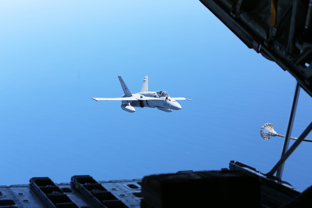 SPMAGTF-CR-AF KC-130J's and Spanish F/A-18's conduct an aerial refuel