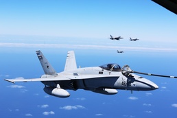 SPMAGTF-CR-AF KC-130J's and Spanish F/A-18's conduct an aerial refuel