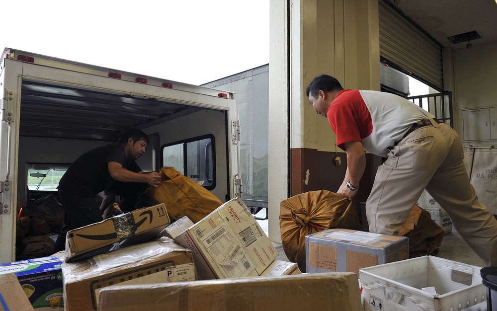 Post Office civilians distribute mail for Team Kadena