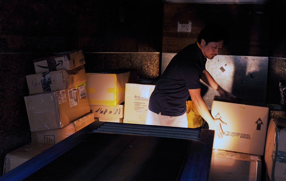 Post Office civilians distribute mail for Team Kadena