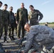 U.S. Army A Sgt. First Class assists German paratroopers