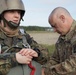 U.S. Army Capt. assists German Capt. on donning the MC-6 Harness