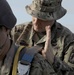 U.S. Army jumpmaster checks parachute.