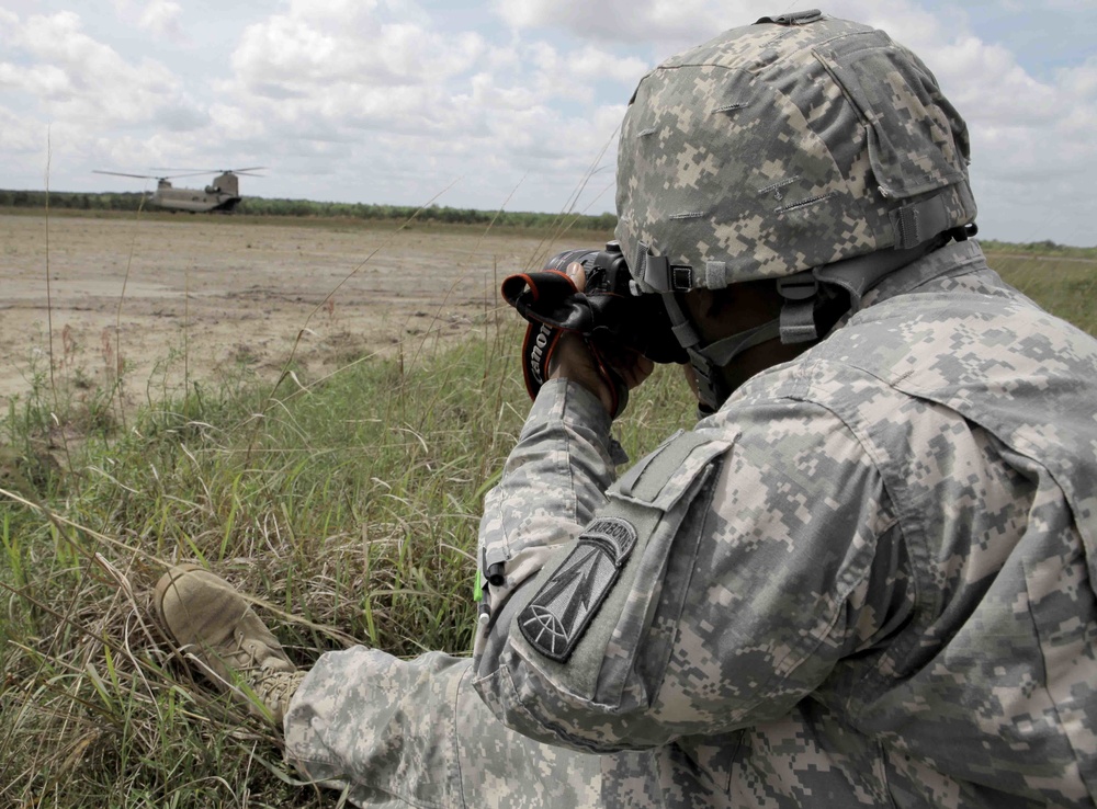 Combat camera soldier photographs chinook