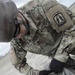 U.S. Army soldier packs parachute.