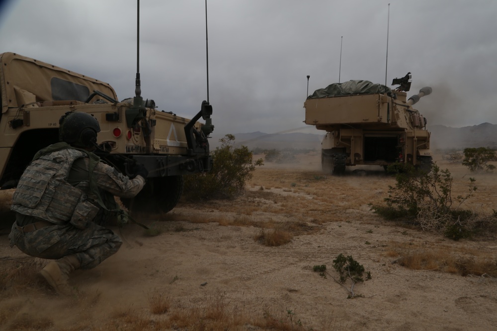 Soldier operates the  M109A6 Paladin to calibrate its weapon system