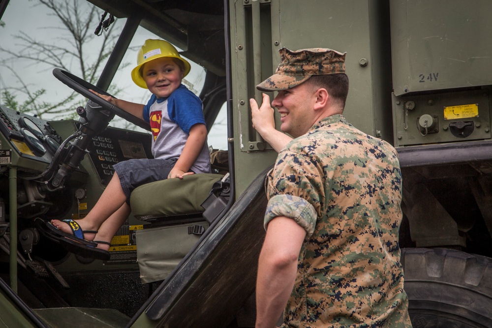 Children mount up during Touch A Truck event