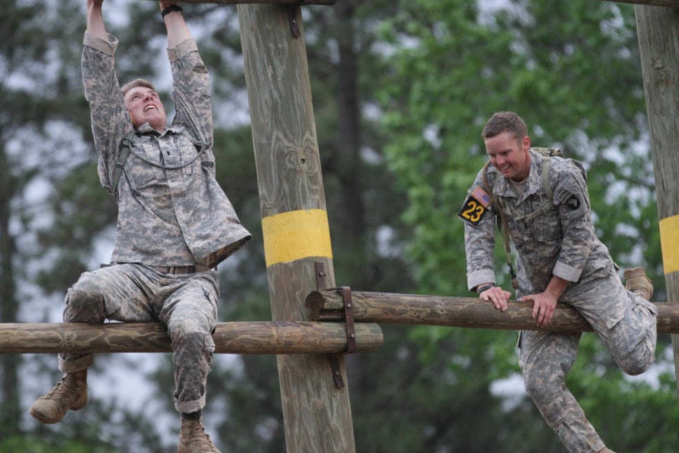 Best Ranger competitors climb an obstacle