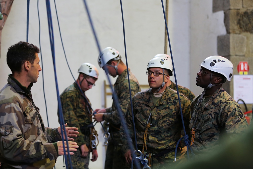 SPMAGTF-CR-AF Marines learn basic rock climbing techniques from French Commandos