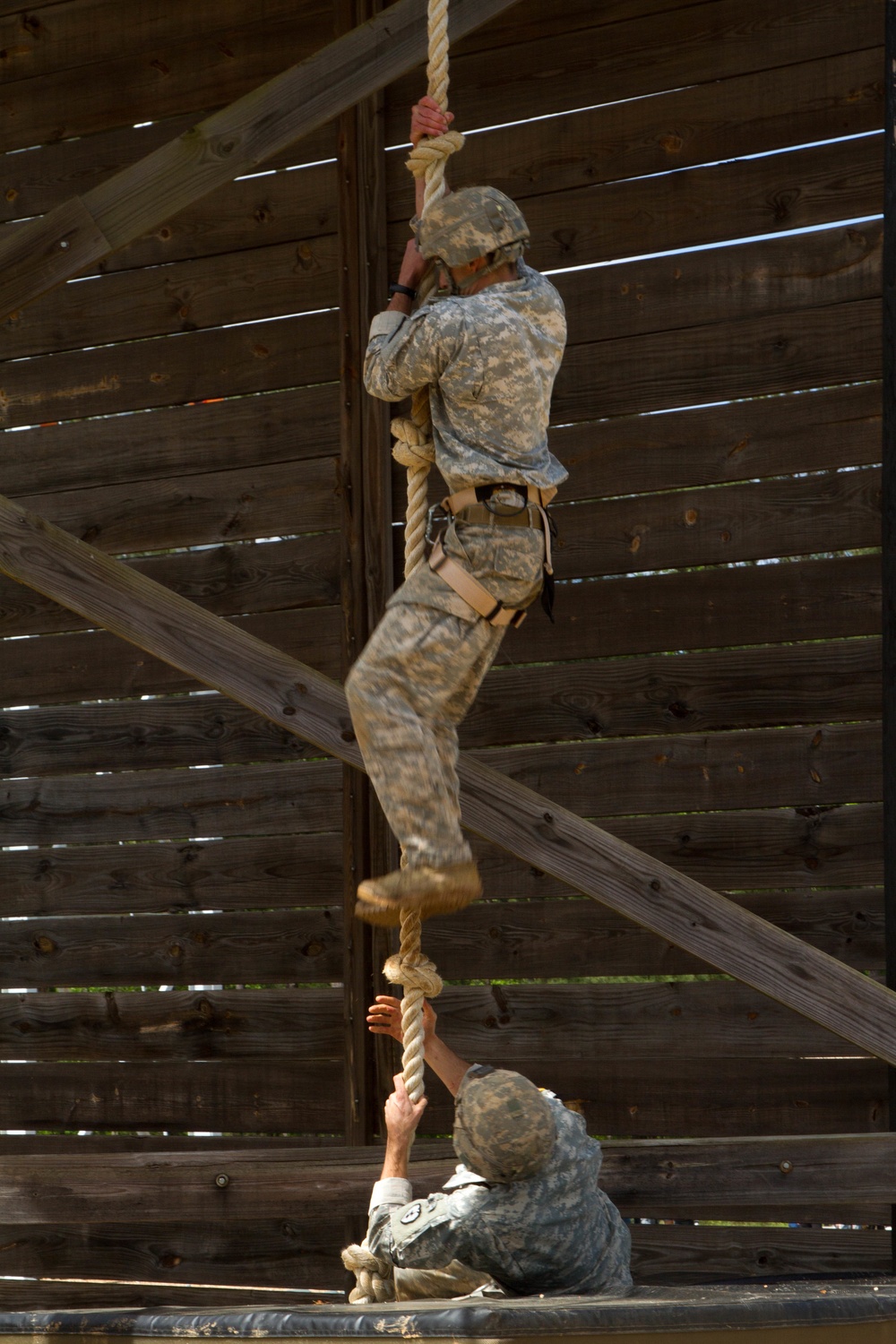 Army Rangers complete an obstacle during competition