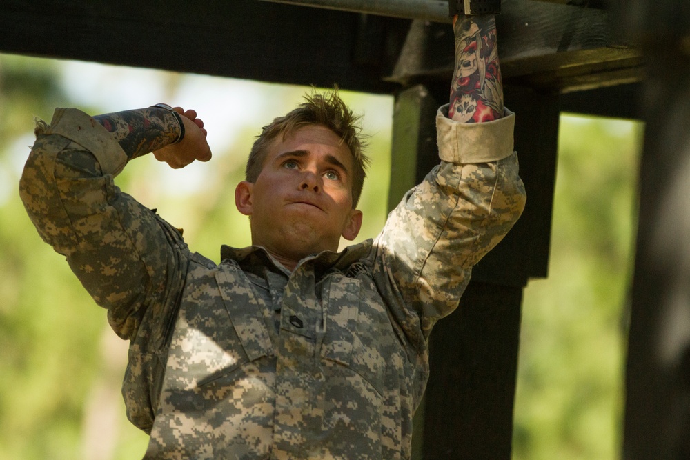 Army Ranger moves through obstacle