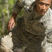 Army Ranger moves through obstacle course