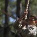 Army Ranger moves through obstacle course