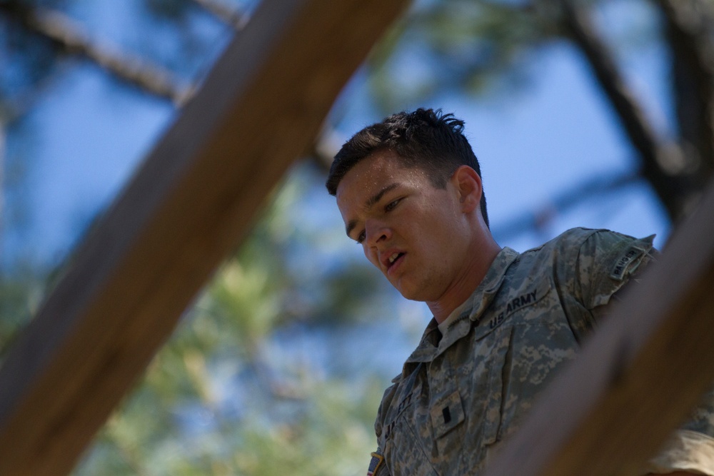 Army Ranger moves through obstacle